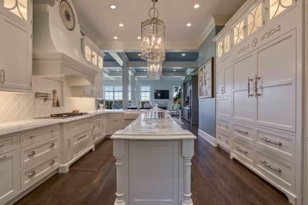 Formal White Kitchen With Custom Clock Hood