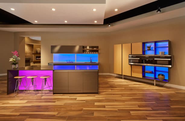 Grey Gloss Cabinetry With A Waterfall Island